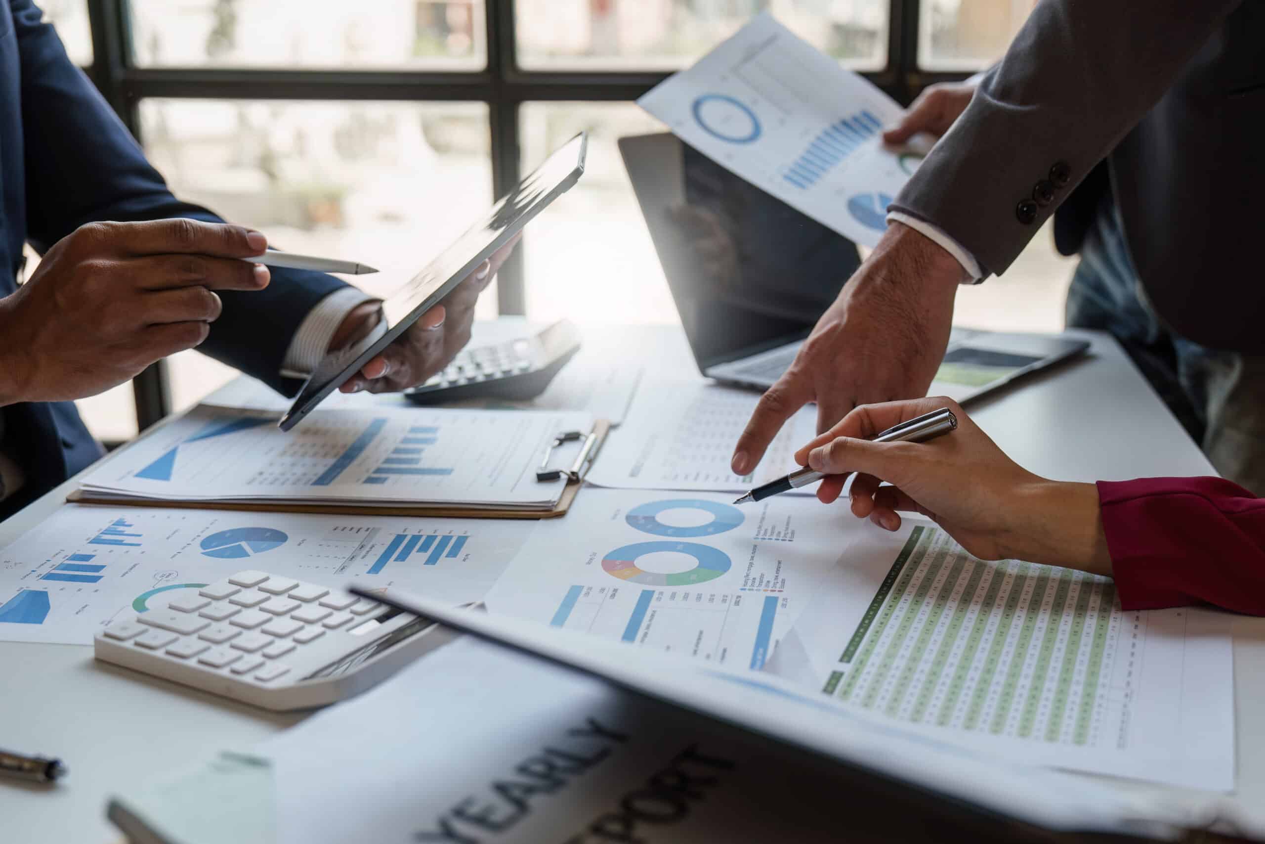 Businessman working with tablet analysing documents